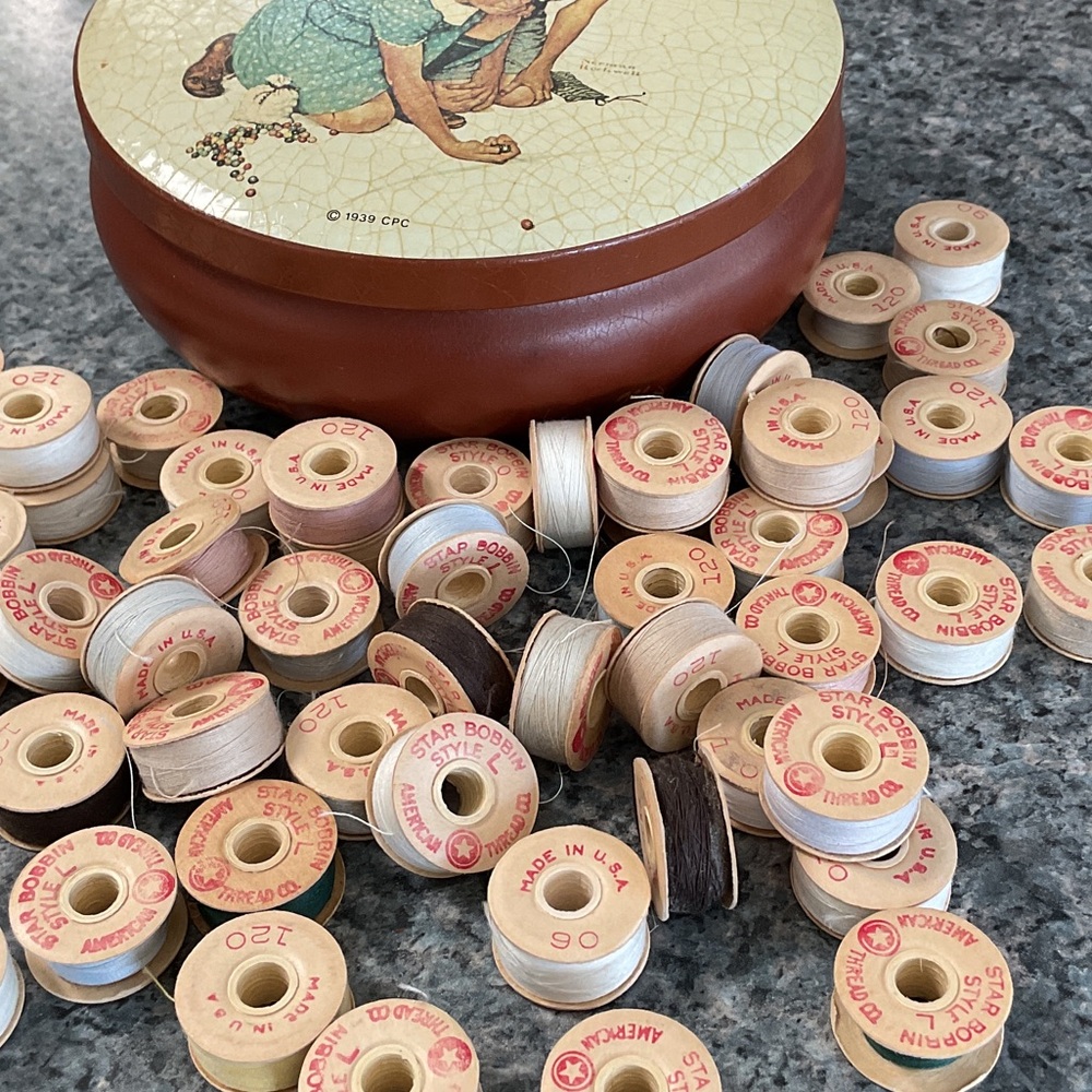 60 vintage Star Bobbins in covered tin